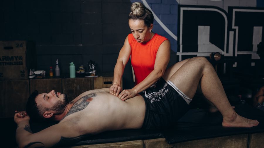 A patient receiving deep tissue massage treatment